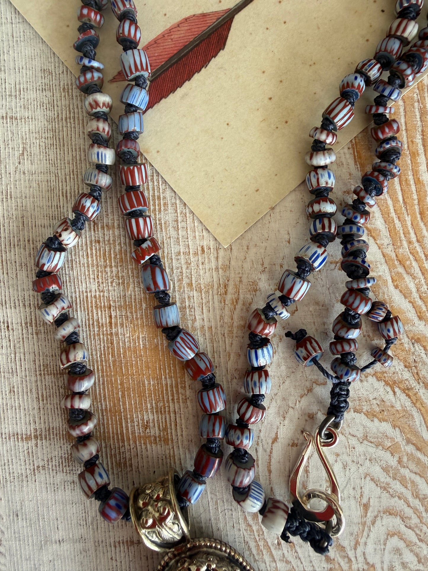 Lapis lazuli pendant (Tibet) with hand knotted blue terracotta chevron beads long necklace.