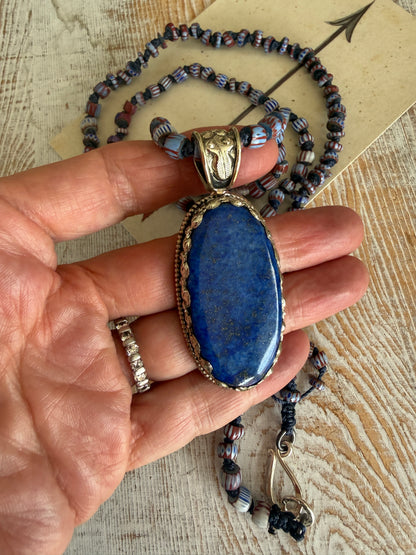Lapis lazuli pendant (Tibet) with hand knotted blue terracotta chevron beads long necklace.