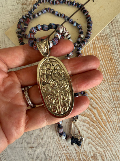 Lapis lazuli pendant (Tibet) with hand knotted blue terracotta chevron beads long necklace.