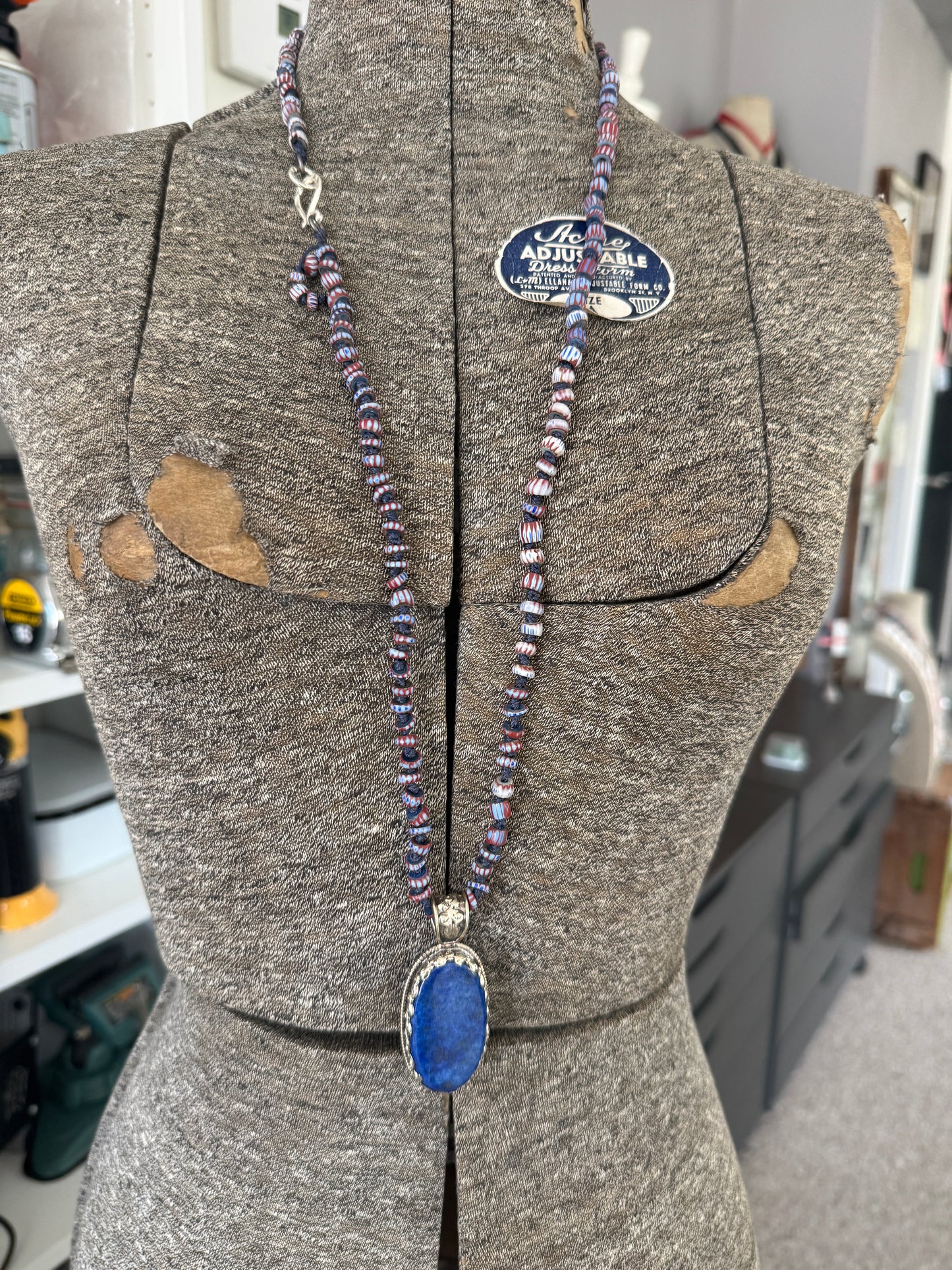 Lapis lazuli pendant (Tibet) with hand knotted blue terracotta chevron beads long necklace.
