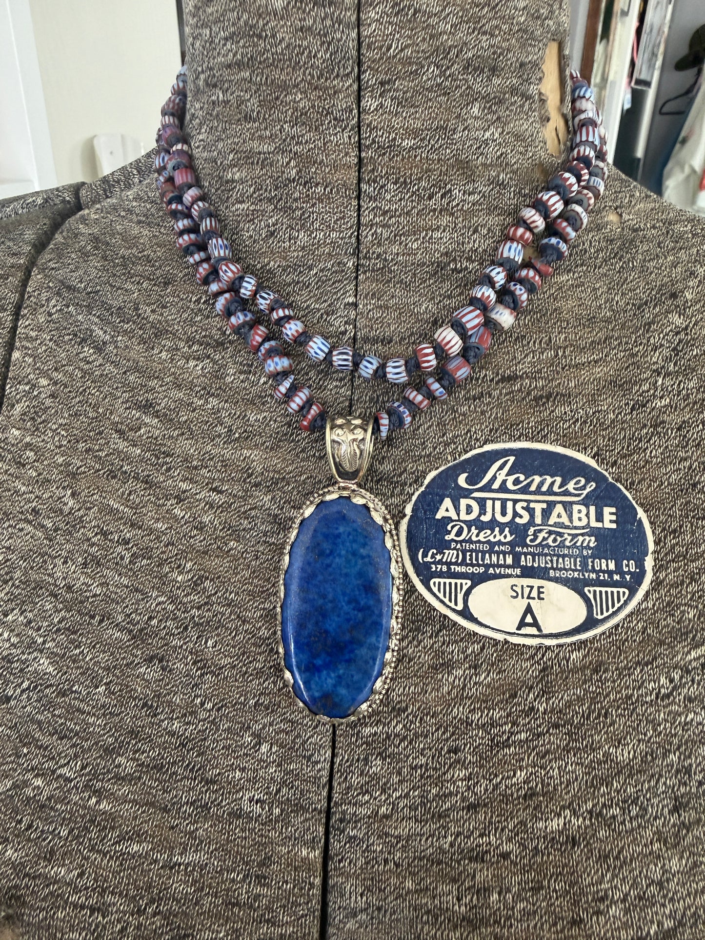 Lapis lazuli pendant (Tibet) with hand knotted blue terracotta chevron beads long necklace.