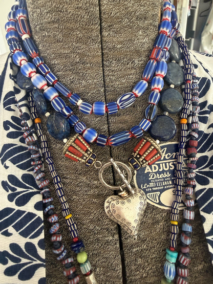 Blue, red, and white tribal chevron beads on leather adjustable necklace. 36”