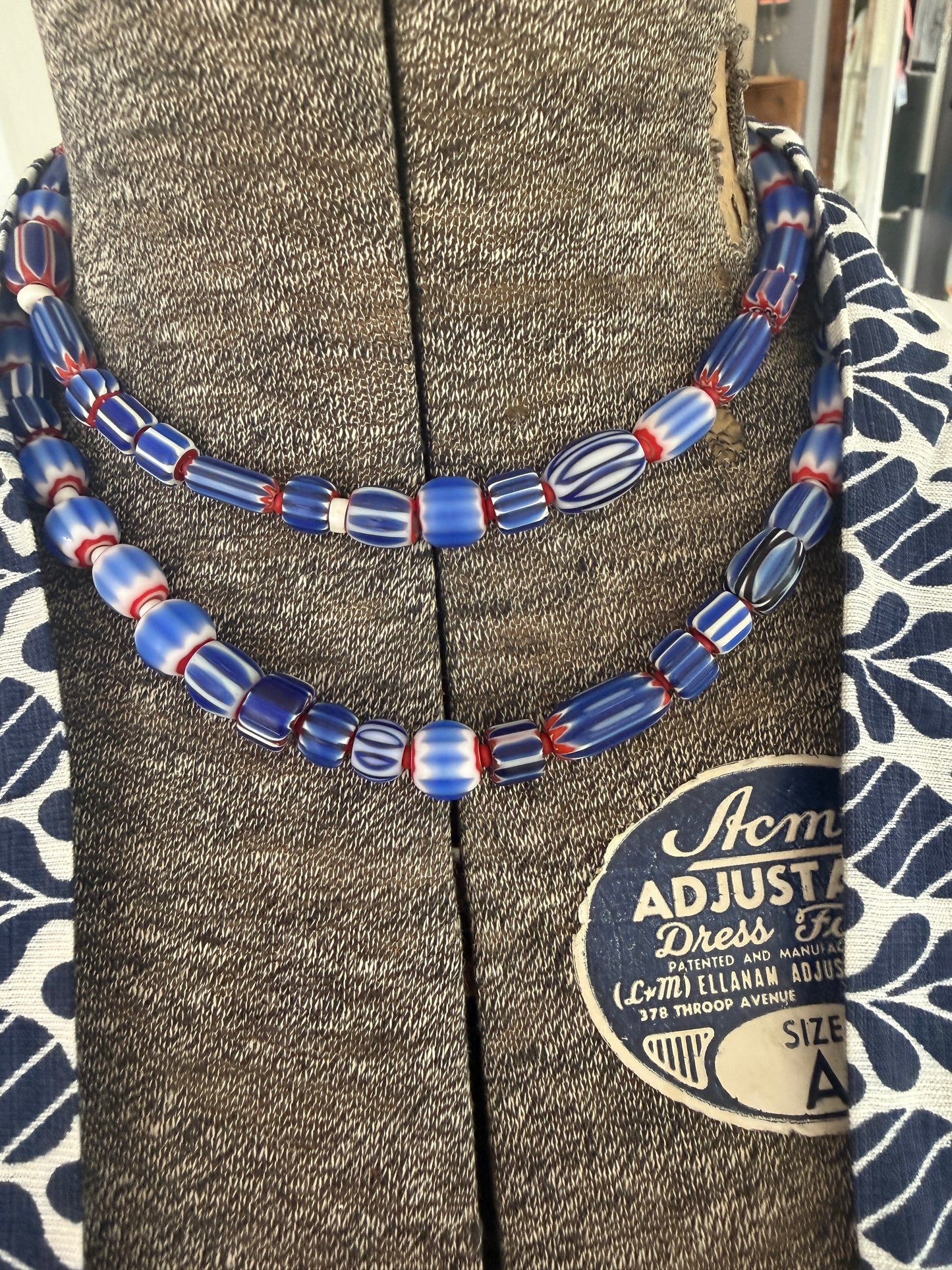 Blue, red, and white tribal chevron beads on leather adjustable necklace. 36”