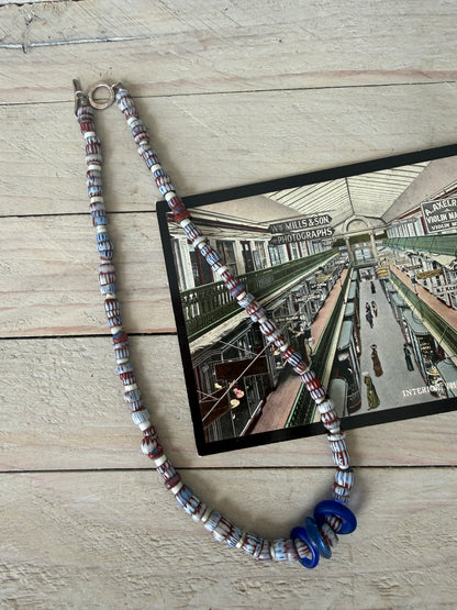 Blue and terracotta red trade bead boho beach necklace with three glass rings. 17.5”