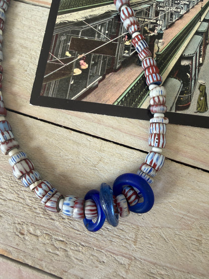 Blue and terracotta red trade bead boho beach necklace with three glass rings. 17.5”