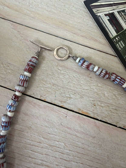 Blue and terracotta red trade bead boho beach necklace with three glass rings. 17.5”