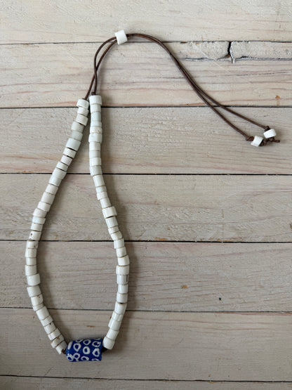 White milk glass beads from Africa with blue polkadot krobo bead focal adjustable necklace on leather. Adjust up to 30”