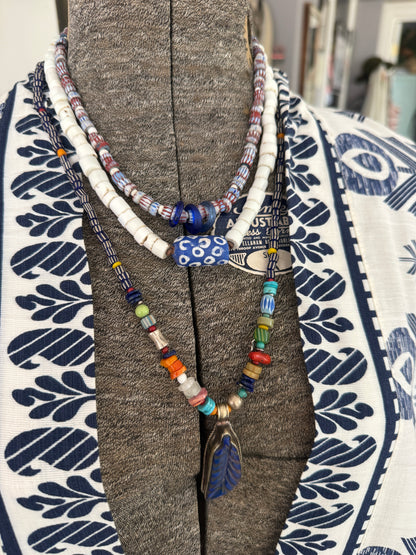 Blue and terracotta red trade bead boho beach necklace with three glass rings. 17.5”