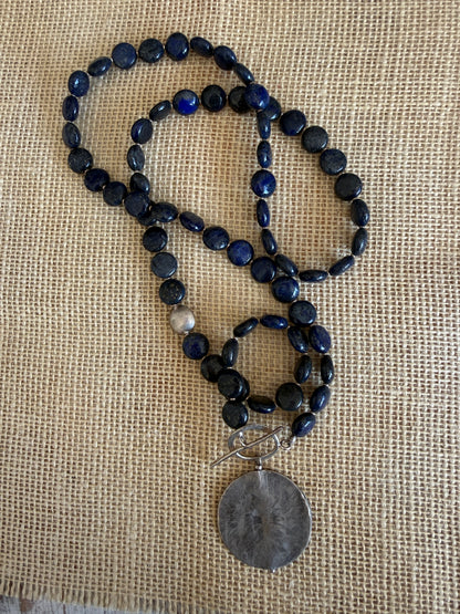 Blue lapis lazuli coins with fine silver front toggle and large textured coin pendant necklace.