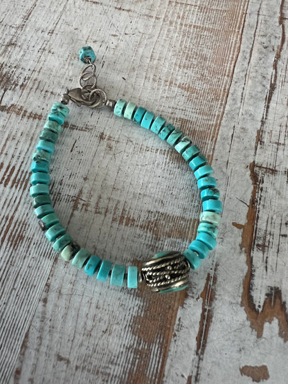 Old Tibetan turquoise focal with turquoise heishi beads. Adjustable bracelet 7-8.25”.