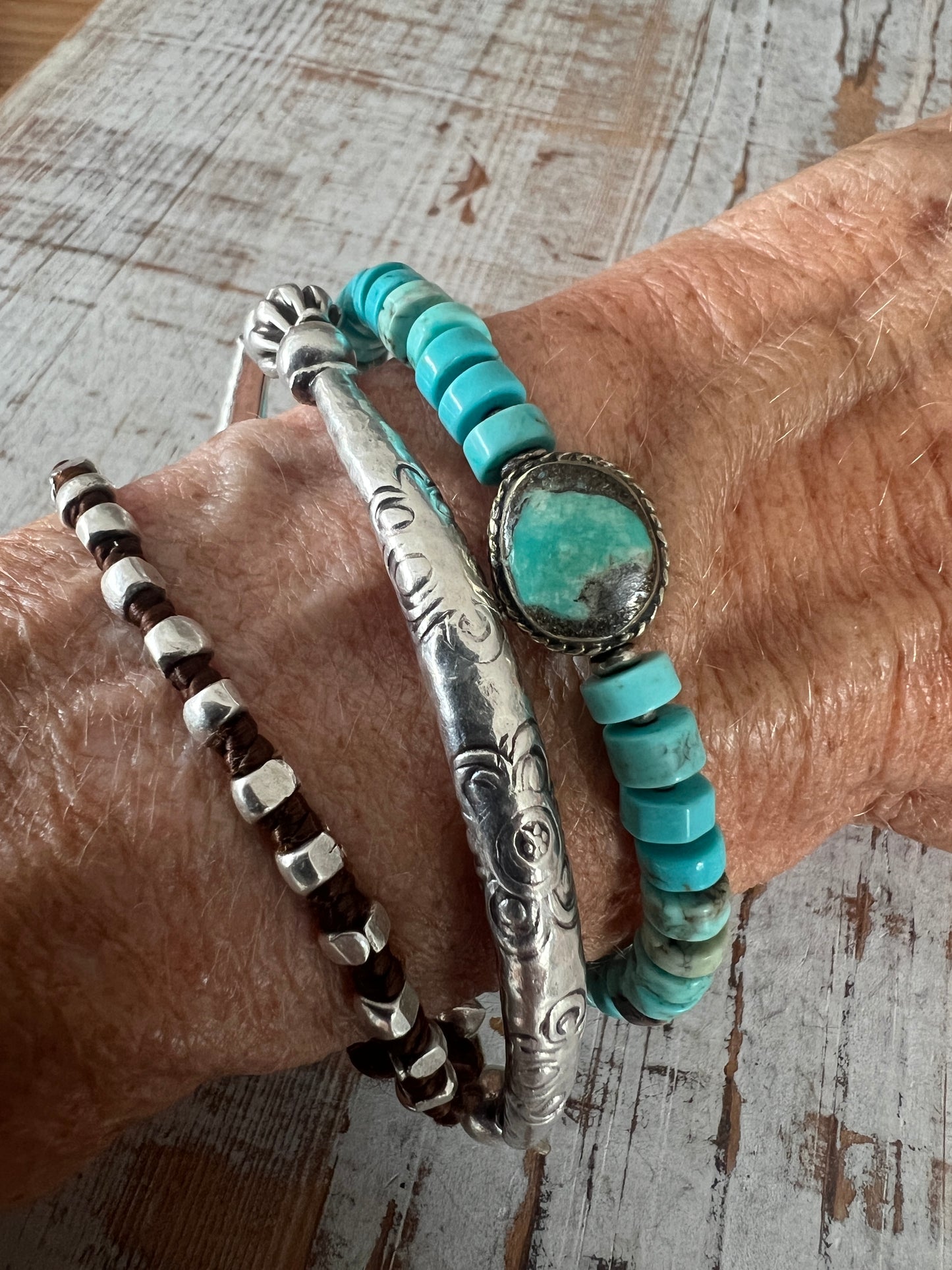 Old Tibetan turquoise focal with turquoise heishi beads. Adjustable bracelet 7-8.25”.