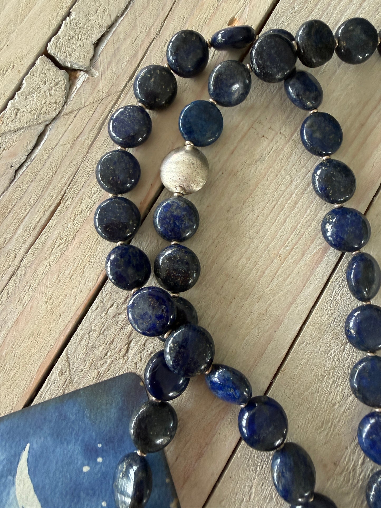 Blue lapis lazuli coins with fine silver front toggle and large textured coin pendant necklace.