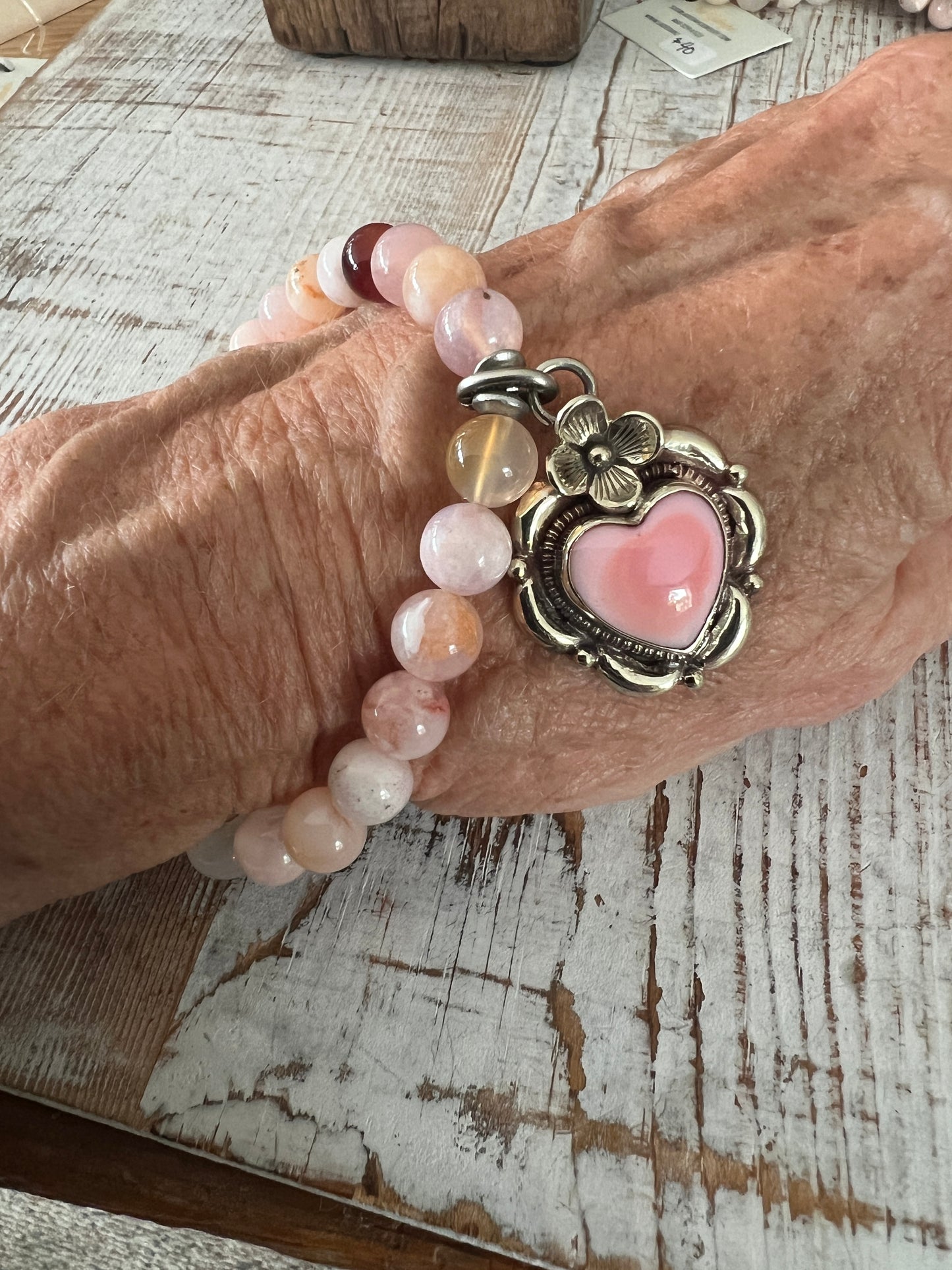 Tibetan silver Peruvian Opal heart charm on cherry blossom agates. Stretch stack bracelet. 7”.