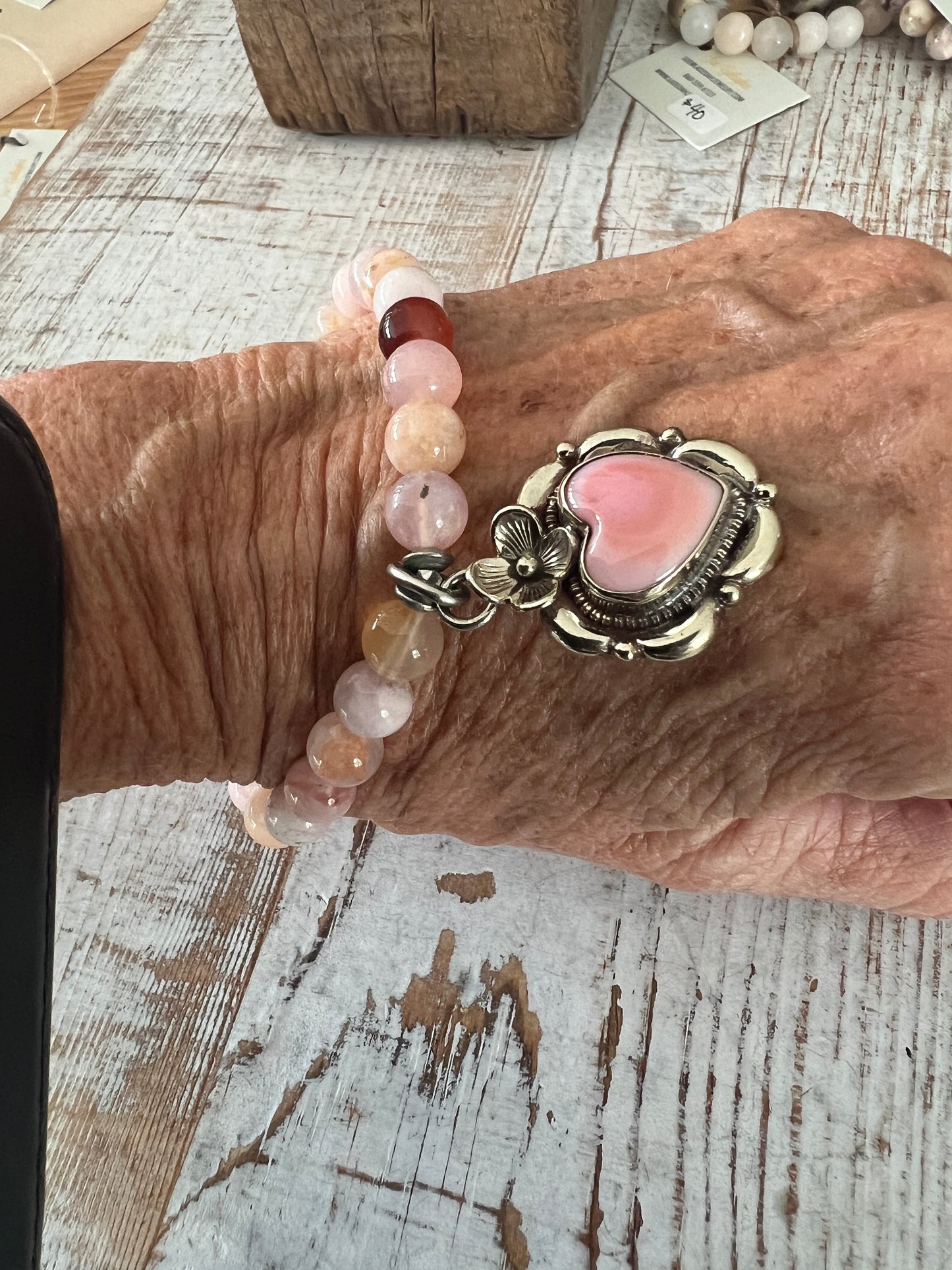 Tibetan silver Peruvian Opal heart charm on cherry blossom agates. Stretch stack bracelet. 7”.