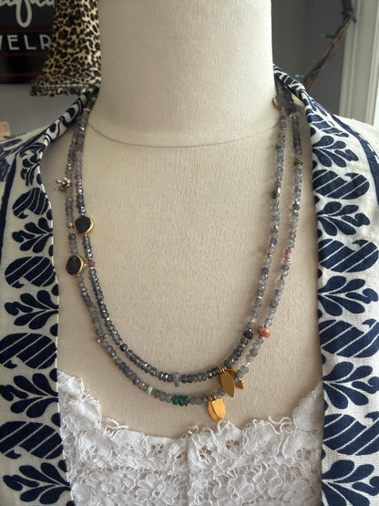 Extra long layering necklace/bracelet of pale iolite and assorted gems with vermeil and fine silver accents on adjustable deerskin leather. 50”