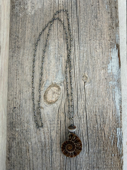 Natural ammonite fossil on pyrite chain necklace.