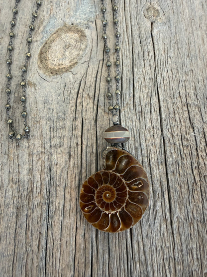 Natural ammonite fossil on pyrite chain necklace.