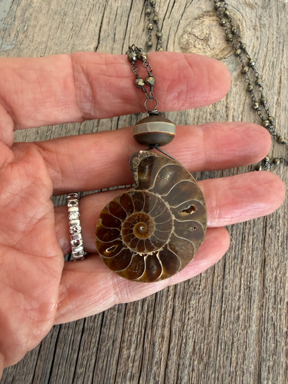 Natural ammonite fossil on pyrite chain necklace.