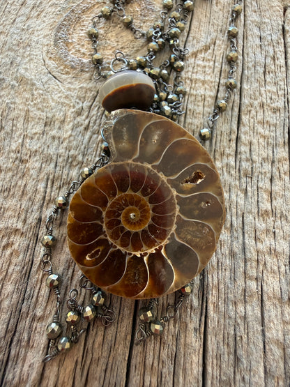 Natural ammonite fossil on pyrite chain necklace.