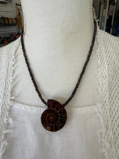 Ammonite fossil on chocolate pyrite necklace. 17.5-19”