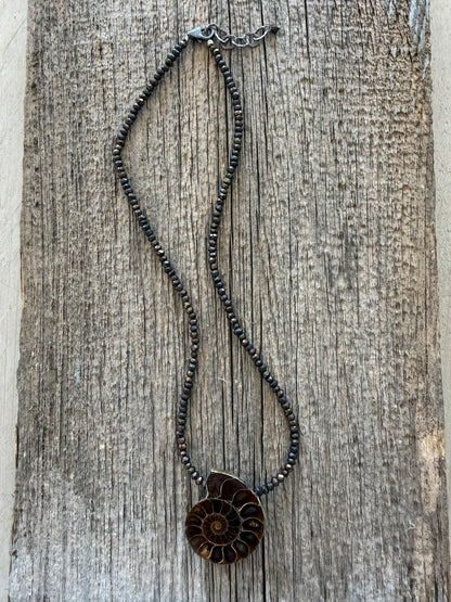 Ammonite fossil on chocolate pyrite necklace. 17.5-19”