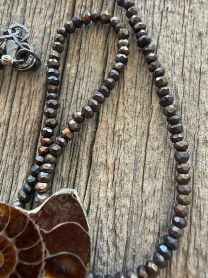 Ammonite fossil on chocolate pyrite necklace. 17.5-19”