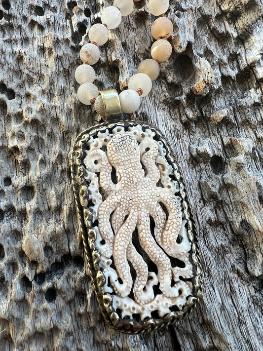 Carved bone octopus on hand-knotted druzy agates.  39” necklace. Wear long or short.