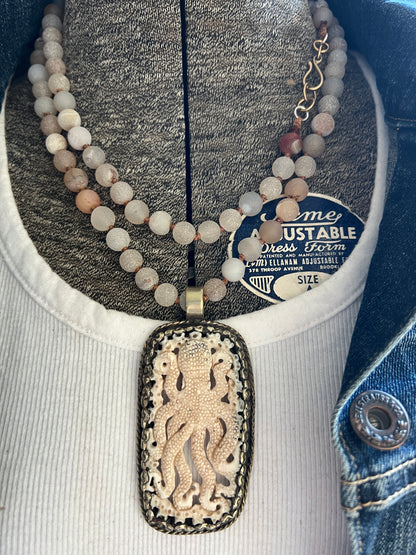 Carved bone octopus on hand-knotted druzy agates.  39” necklace. Wear long or short.