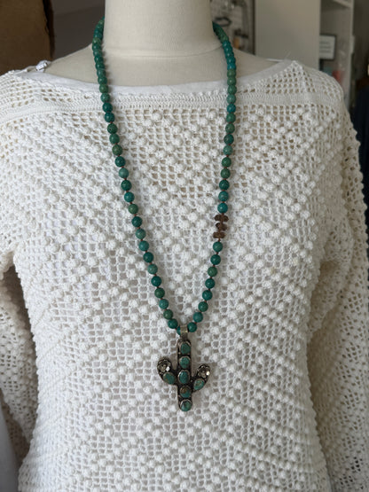 Turquoise cactus pendant necklace on knotted turquoise with smoky quartz and fine silver accents.