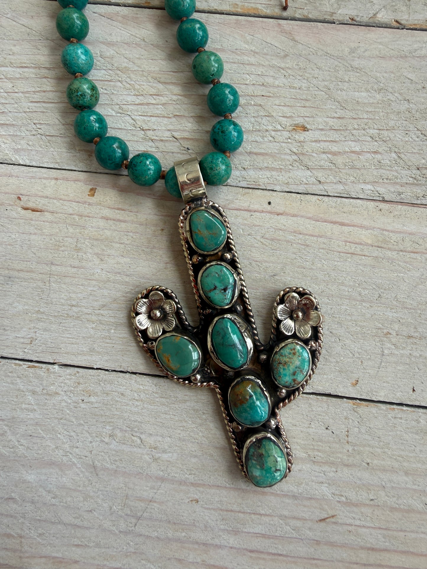 Turquoise cactus pendant necklace on knotted turquoise with smoky quartz and fine silver accents.