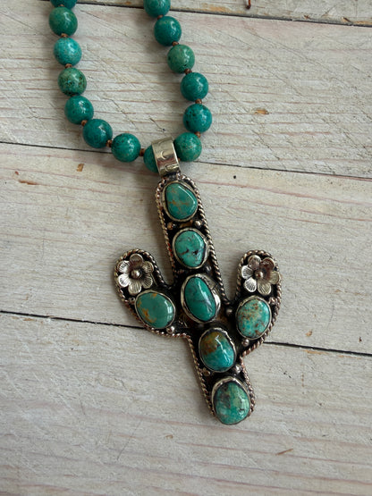 Turquoise cactus pendant necklace on knotted turquoise with smoky quartz and fine silver accents.