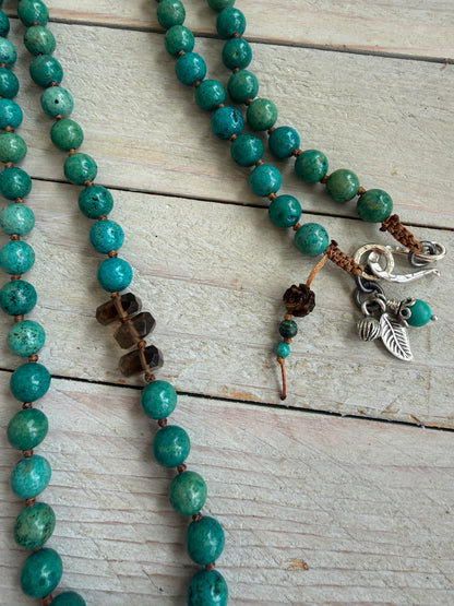Turquoise cactus pendant necklace on knotted turquoise with smoky quartz and fine silver accents.