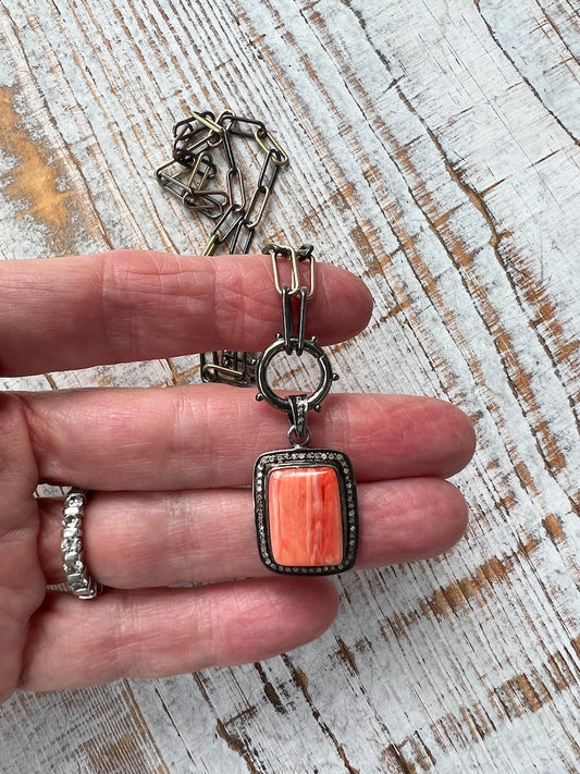 Coral and diamond pavé pendant on tri-tone sterling chain with circular hinged clasp. 16.5” Removable pendant.