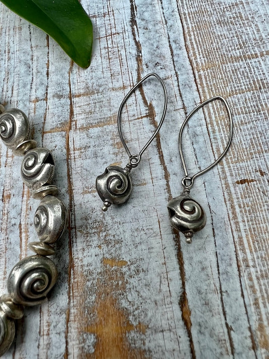 Shark eye snail fine silver earrings. Long, dangle earring.