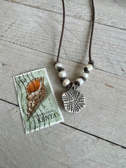 Fine silver sand dollar on brown leather choker 16”. Casual everyday boho necklace. Beach lover gift.