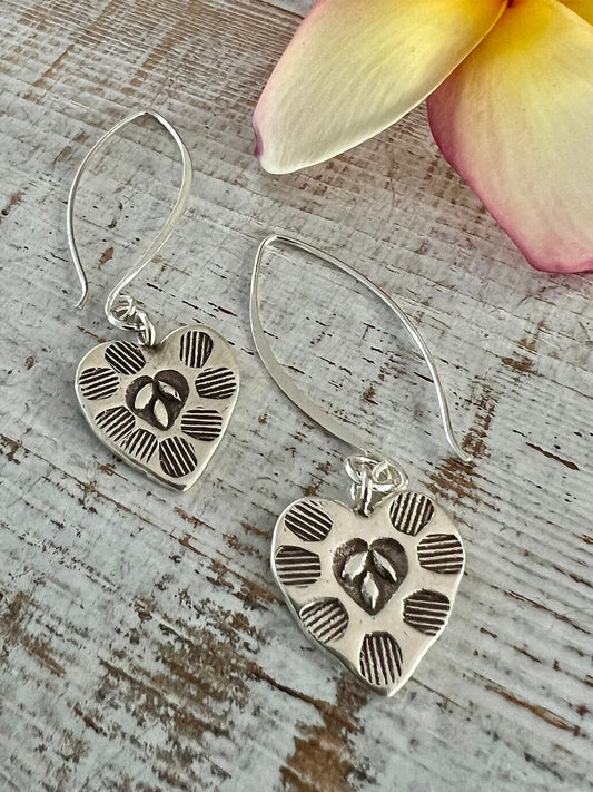 Fine silver, stamped heart earrings on long handmade fine silver earwires. Valentine’s Day gift. Bff gift. Galentine’s day gift.