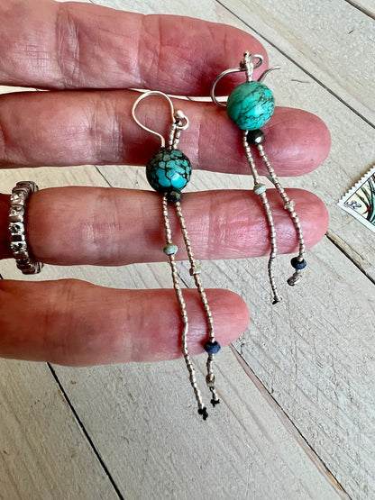 Turquoise with fine silver, pyrite, and lapis dangle earrings on fine silver ear wires. 3” long dangle earrings. Lightweight.