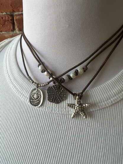 Fine silver sand dollar on brown leather choker 16”. Casual everyday boho necklace. Beach lover gift.