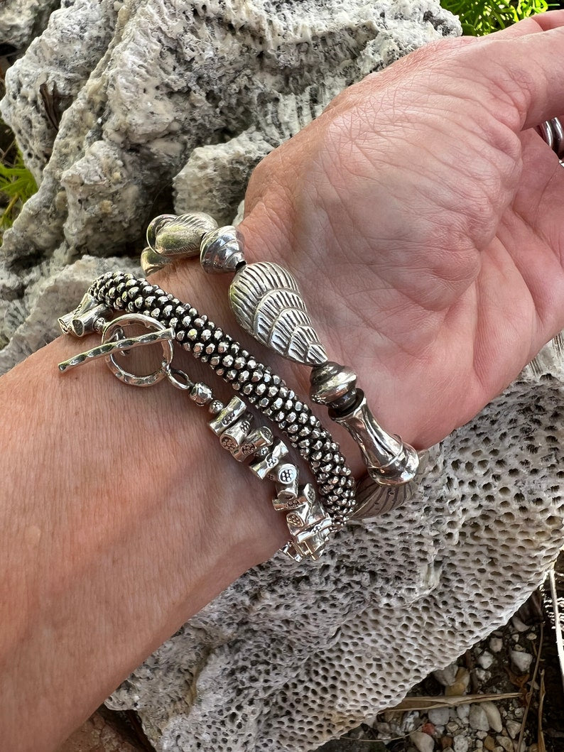 Fine silver seashell stretch bracelet for beach combers, beach bums, and shell collectors. OOAK. Non tarnish 98%+ silver.