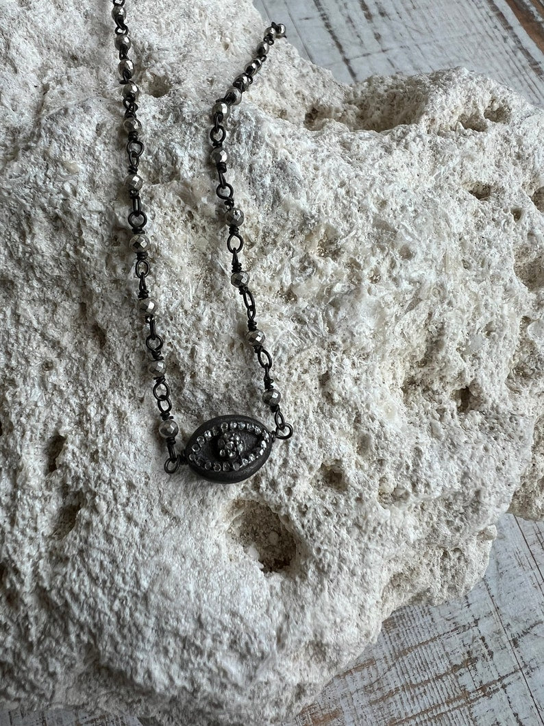 Diamond eye of Horus on sterling and. Silver pyrite chain. Delicate layering necklace. Adjustable 15-17”.