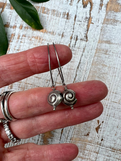 Shark eye snail fine silver earrings. Long, dangle earring.