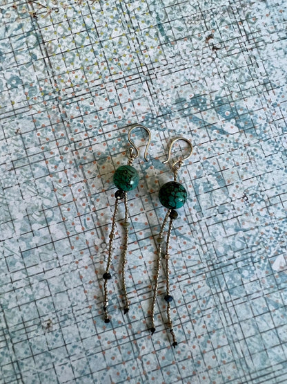 Turquoise with fine silver, pyrite, and lapis dangle earrings on fine silver ear wires. 3” long dangle earrings. Lightweight.