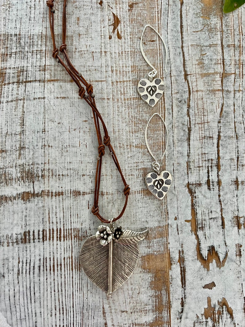 Fine silver, stamped heart earrings on long handmade fine silver earwires. Valentine’s Day gift. Bff gift. Galentine’s day gift.