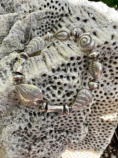 Fine silver seashell stretch bracelet for beach combers, beach bums, and shell collectors. OOAK. Non tarnish 98%+ silver.