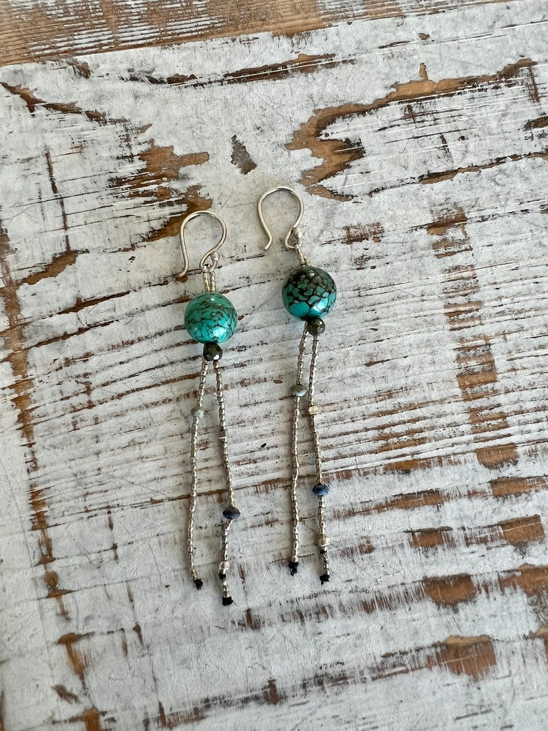 Turquoise with fine silver, pyrite, and lapis dangle earrings on fine silver ear wires. 3” long dangle earrings. Lightweight.