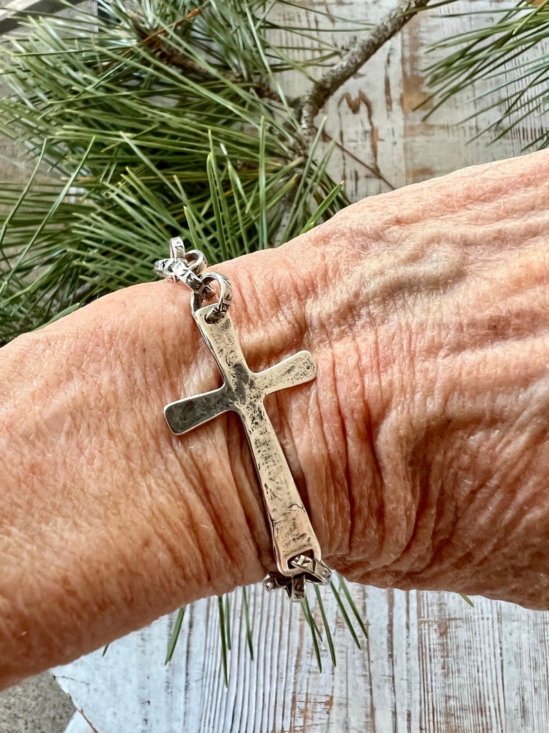 Hammered sterling cross on stamped fine silver chain. Sterling swivel lobster clasp. Great addition to your stack. 7” silver