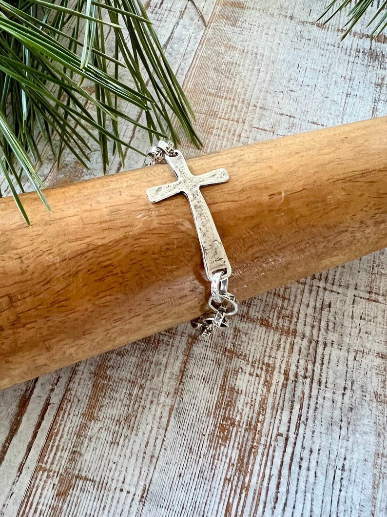 Hammered sterling cross on stamped fine silver chain. Sterling swivel lobster clasp. Great addition to your stack. 7” silver